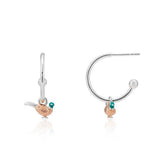 A pair of silver hoop earrings with a pheasant design, featuring rose gold details and green gemstones, displayed against a white background.